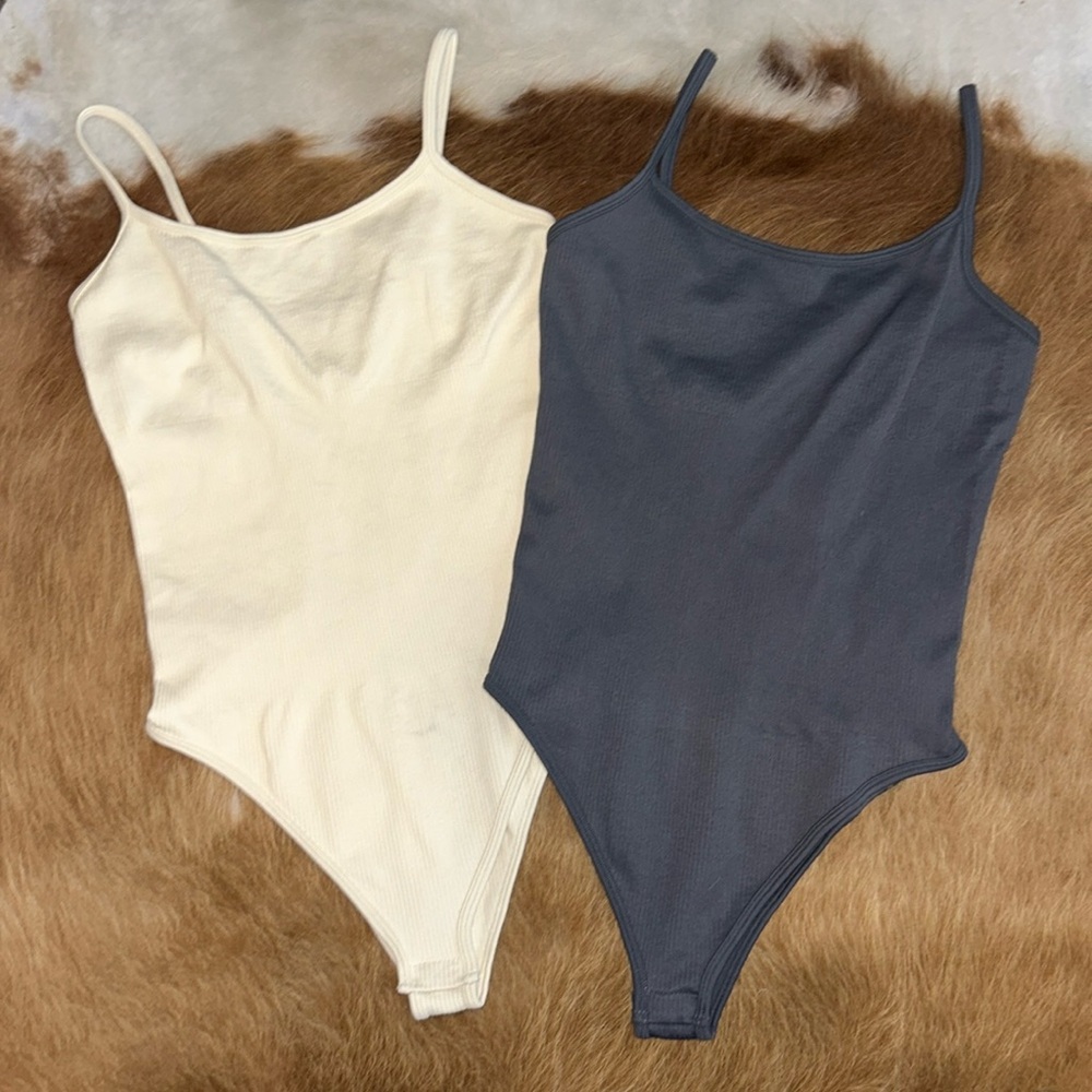 Women’s bodysuit. Never worn. Size medium